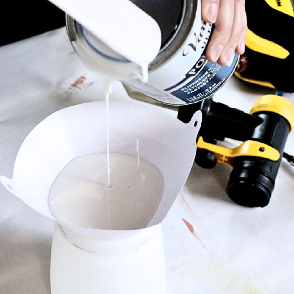 photo of pouring polyurethane into a Wagner paint sprayer