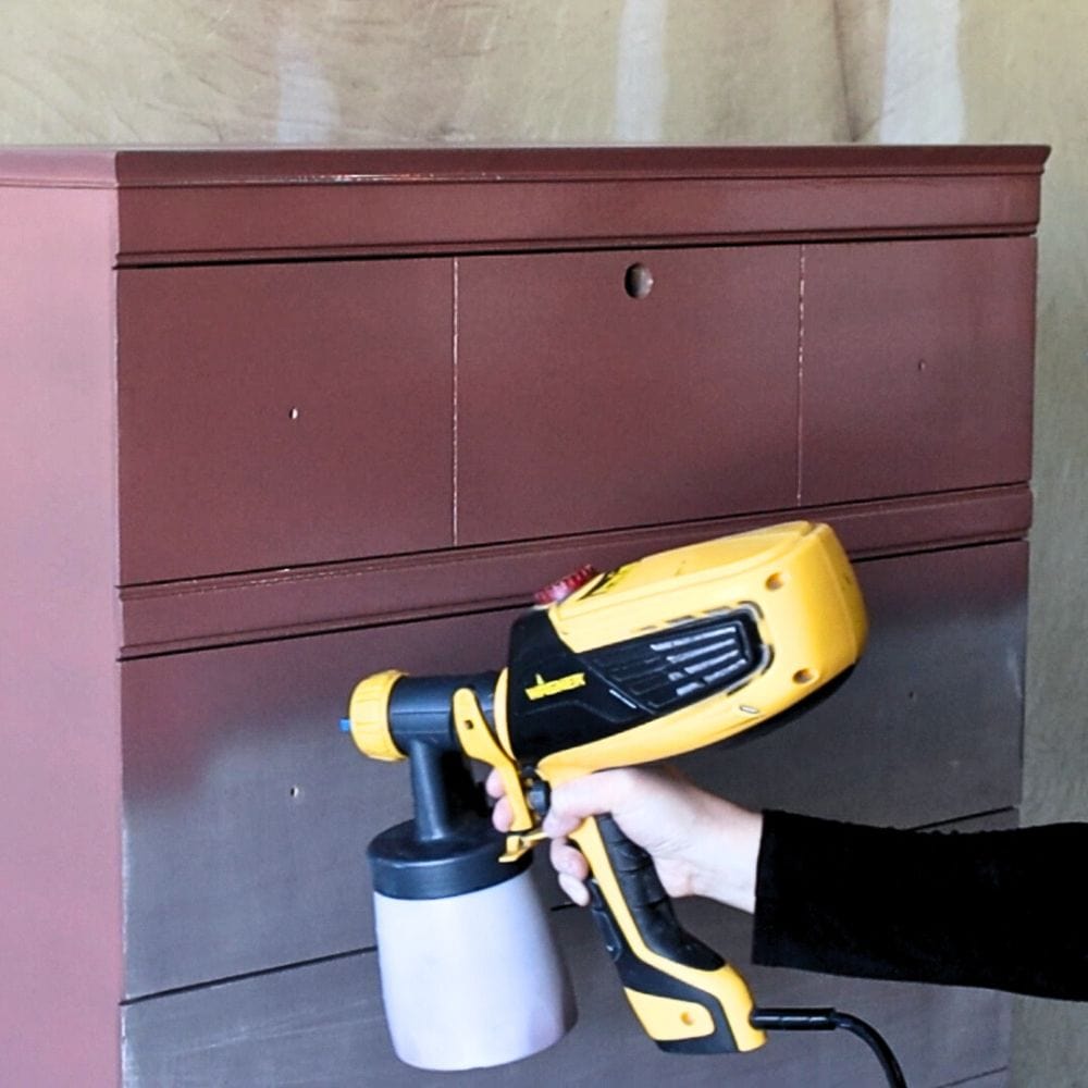 photo of spraying paint onto furniture