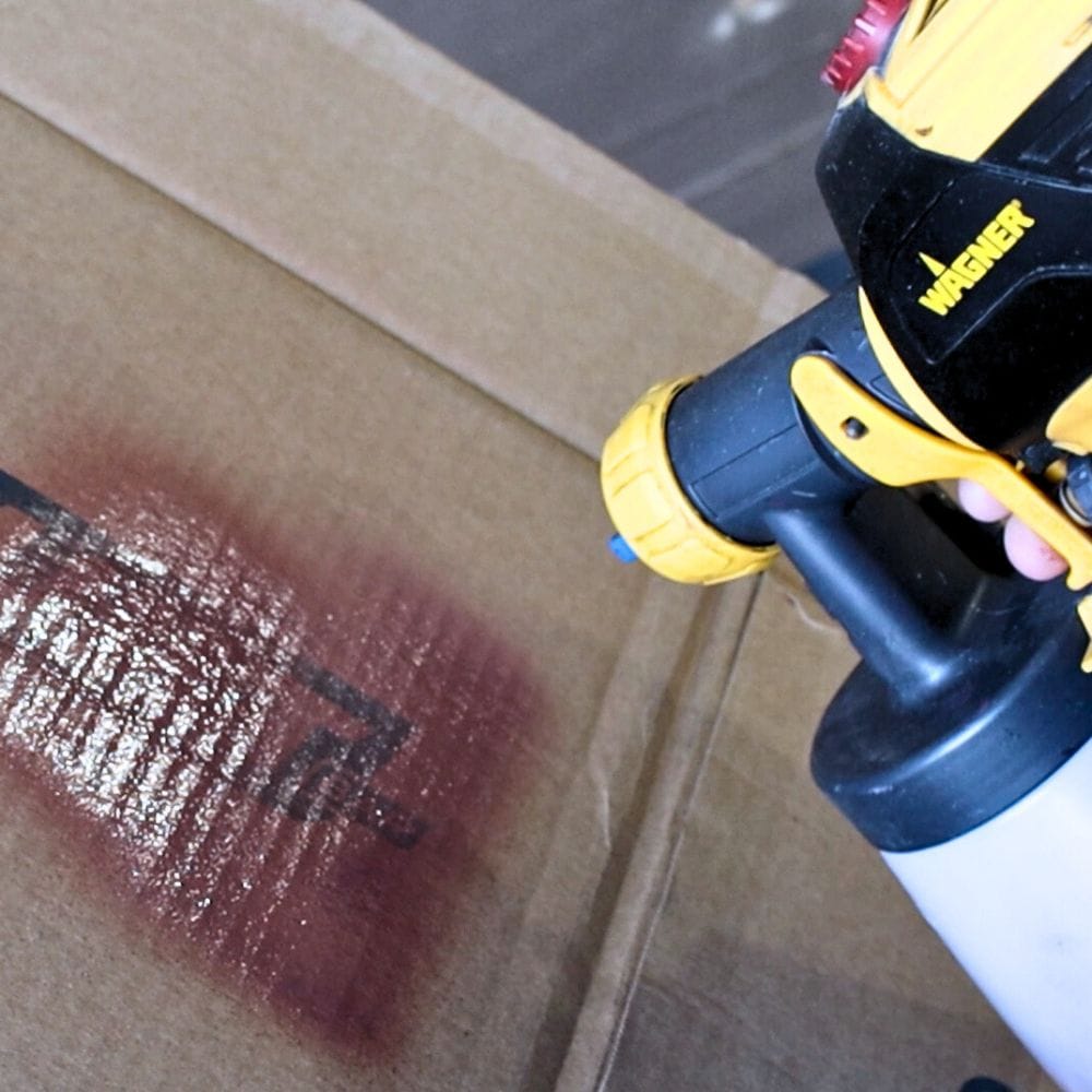 photo of testing the paint sprayer onto cardboard