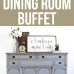 Light blue buffet table with decor, flowers, and framed sign