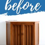 A wooden corner cabinet with double doors, labeled before in large script above it.