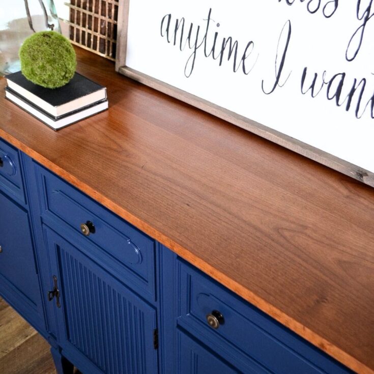 close up of blue dresser with wood top