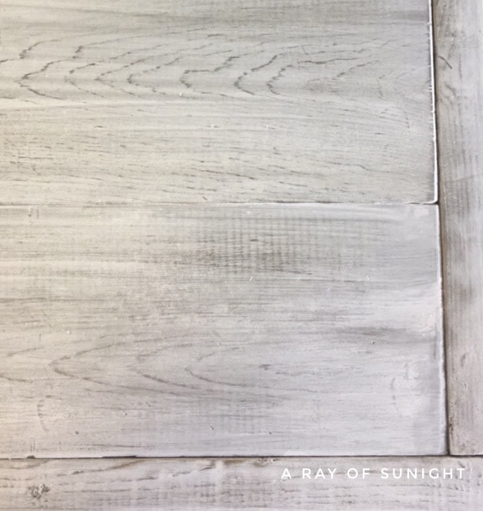 dried whitewash paint over stained wood