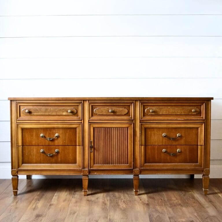 long wooden dresser with 9 drawers