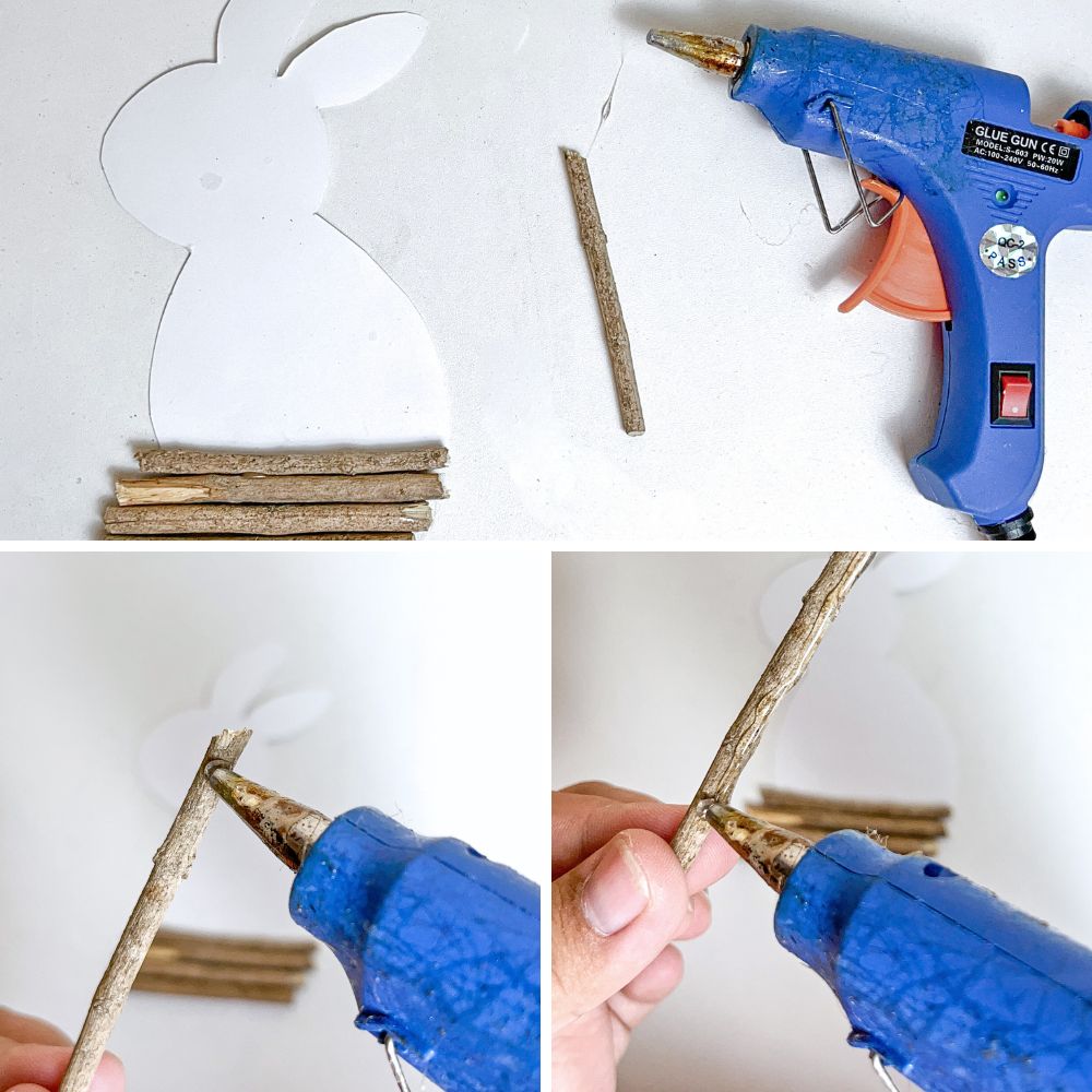 photo of gluing twigs onto bunny-shaped paper using a glue gun 