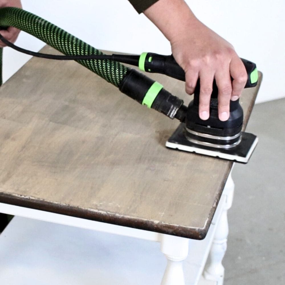 photo of light sanding the furniture after using chemical stripper 