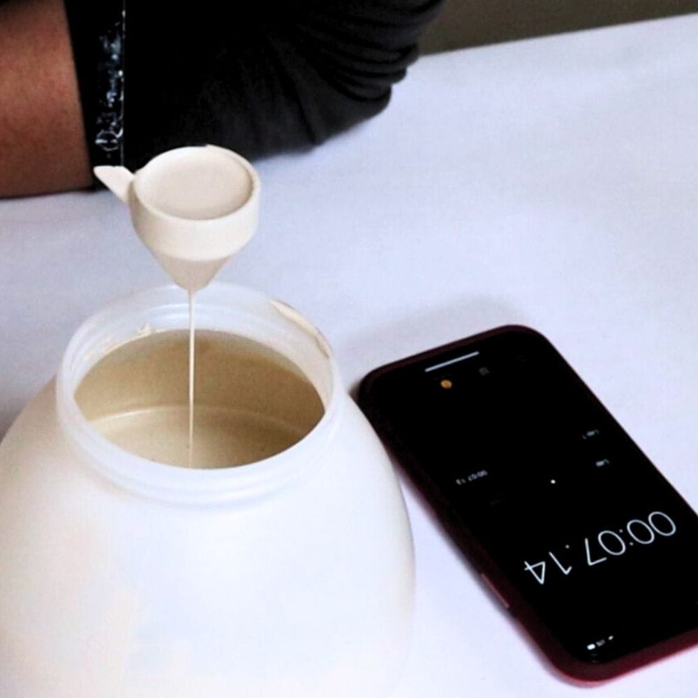 photo of using viscosity cup to thin paint