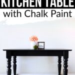 Black kitchen table with turned legs, vase of flowers, and sign on top; text about painting with chalk paint.