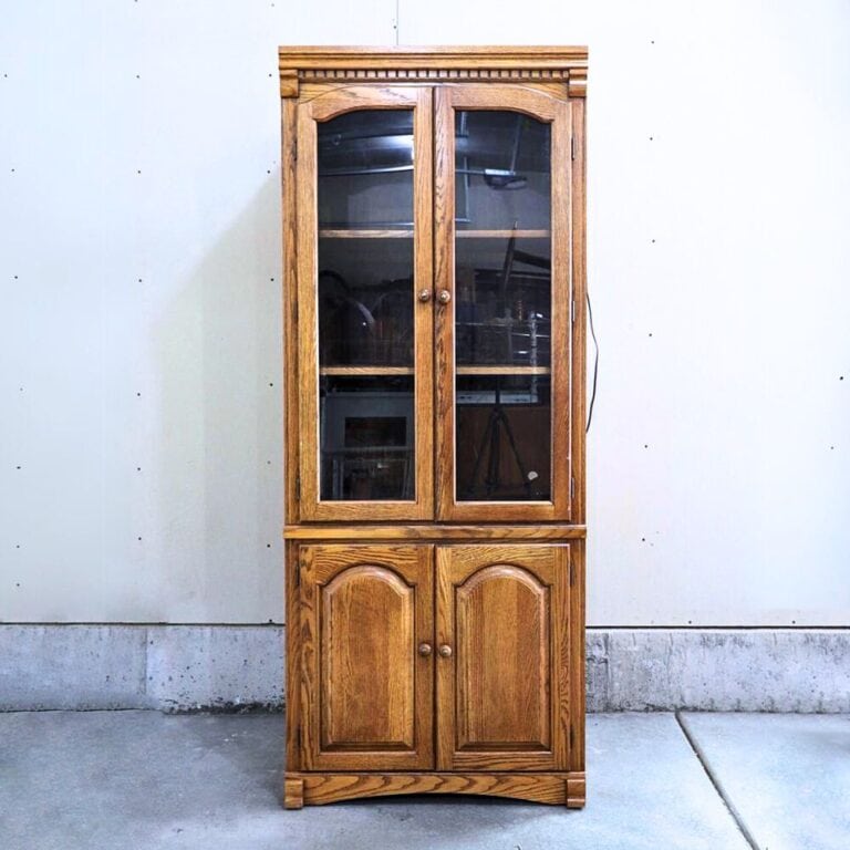 wooden hutch with glass in cabinet doors