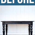 A black wooden table stands against a white wall with BEFORE written above in large white letters.