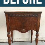 An old wooden side table with carved legs and details