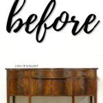Vintage wooden sideboard with brass handles under the word before in large cursive letters.