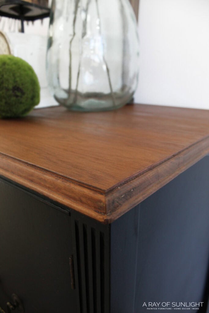 dark wood stained top of black updated furniture