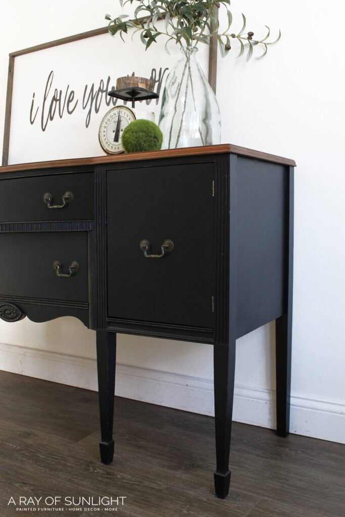 sideview of refinished wooden buffet in black with original hardware