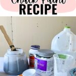 Homemade chalk paint ingredients and tools, including paint, baking soda, a jug, and measuring cups.