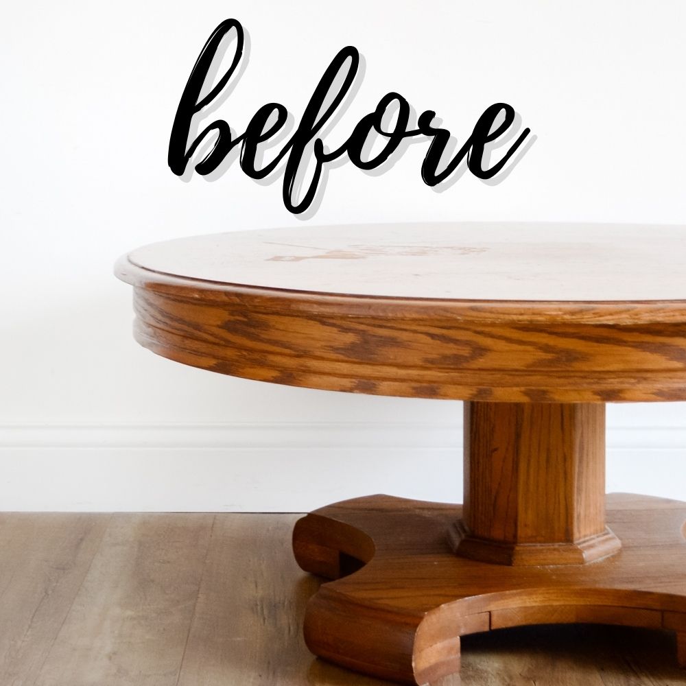 Round wooden table with the word before written above it in cursive text.