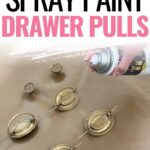 A hand spray painting brass drawer pulls gold on a light surface, with text How to Spray Paint Drawer Pulls.