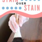 A gloved hand applies stain with a brush to a wooden surface