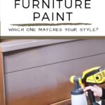 A hand uses a paint sprayer to apply grey paint to a wooden dresser.