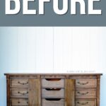 a dark wood dresser with open drawer door cabinet