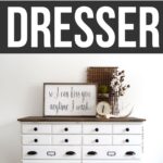 White chalk painted dresser with dark round knobs and pulls