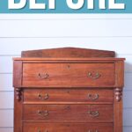 A vintage wooden dresser with four drawers sits below a large sign reading BEFORE.