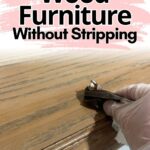 Gloved hand refinishing wood furniture with text: How to Refinish Wood Furniture Without Stripping.