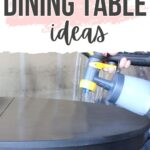 A person uses a paint sprayer to refinish a round dining table. Text reads Refinished Dining Table Ideas.
