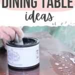 Hand applying finish to a wooden table with a can of stain; text reads Refinished Dining Table Ideas.