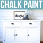 White mahogany cabinet painted with chalk paint, with black handles