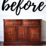 A vintage wooden dresser against a white shiplap wall with before written in bold script above it.