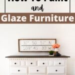 White dresser with stained wood top, decor, and a framed sign against a white wall; text about painting furniture.