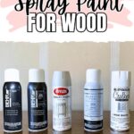 Five cans of different white spray paints for wood are lined up on a wooden surface below a title sign.