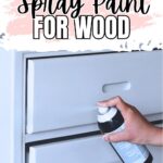 Hand spray painting a white wooden dresser, with text: Best White Spray Paint for Wood.