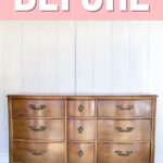 A worn, vintage wooden dresser with nine drawers and brass handles against a white wall. BEFORE text above.