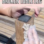 Gloved hands applying filler to a broken wooden table leg with text: How to fix a BROKEN TABLE LEG.