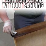 Person staining a wooden drawer with a cloth, wearing gloves. Text: DIY Furniture Stain Without Sanding.