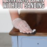 Hand in a glove applying dark stain to a wooden dresser top, blue drawer below. Text: Furniture Stain Without Sanding.