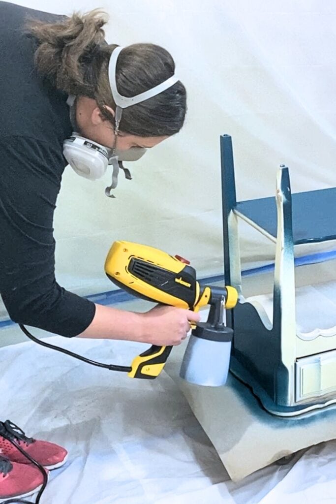 spray painting end table blue