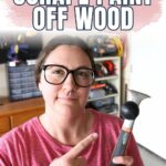 Natalie holding a paint scraper, pointing at it; text reads How to Scrape Paint Off Wood.