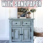 Blue distressed dresser with a vase and books on top, text reads: How to Distress Furniture with Sandpaper.