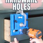 Hands using a drill and a Kreg jig tool to make new hardware holes on a dark green cabinet drawer.