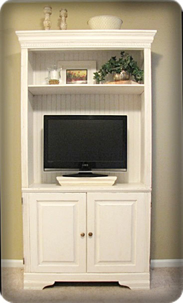 White entertainment cabinet with TV