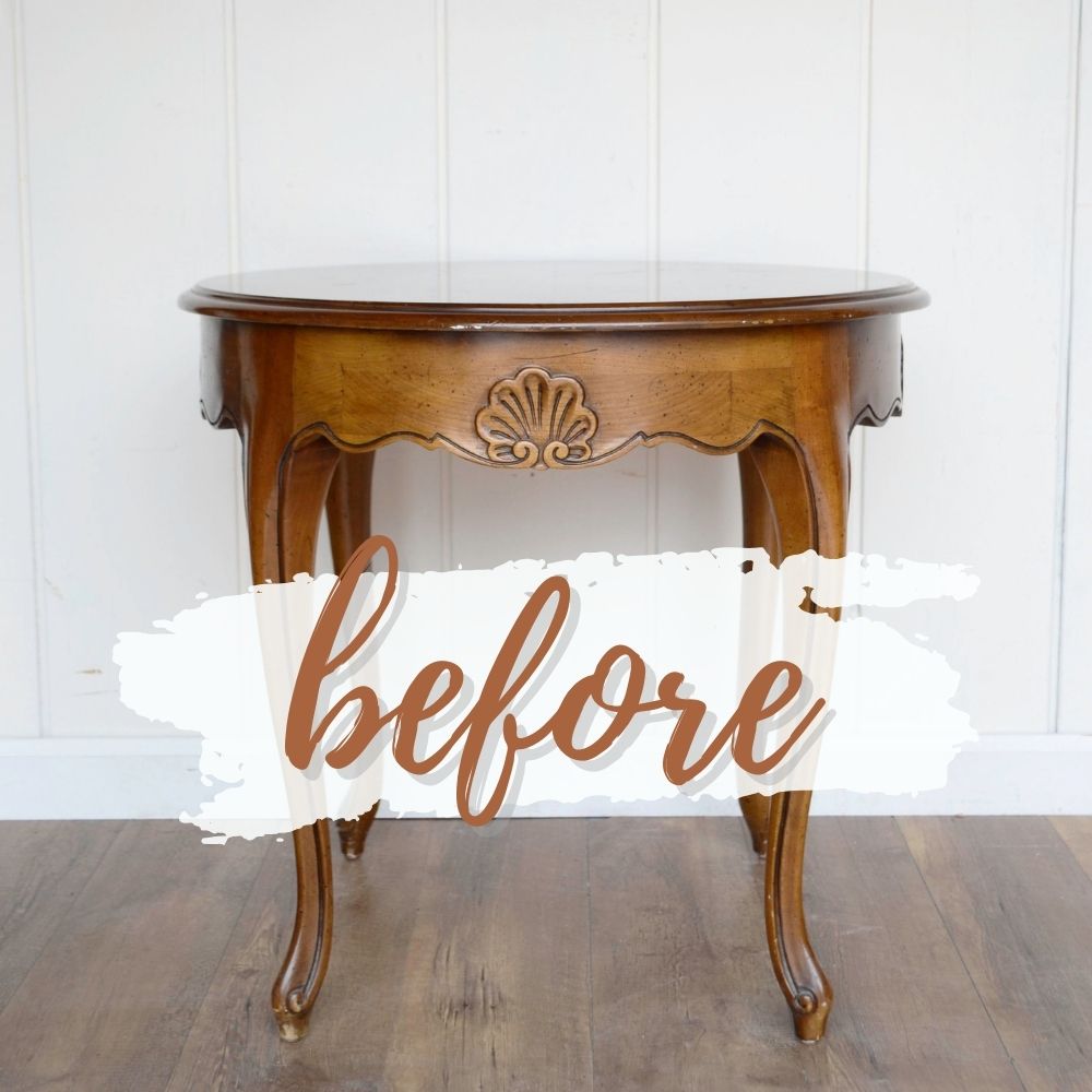 Round wooden table with curved legs and before written across it in script on a white paint stroke background.