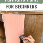 Hand painting wooden furniture with light pink paint