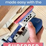 Hand holding a blue electric sander on wood, with text: DIY projects made easy with the SurfPrep Sander.
