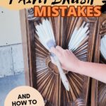 Hand brushing paint on detailed wood furniture