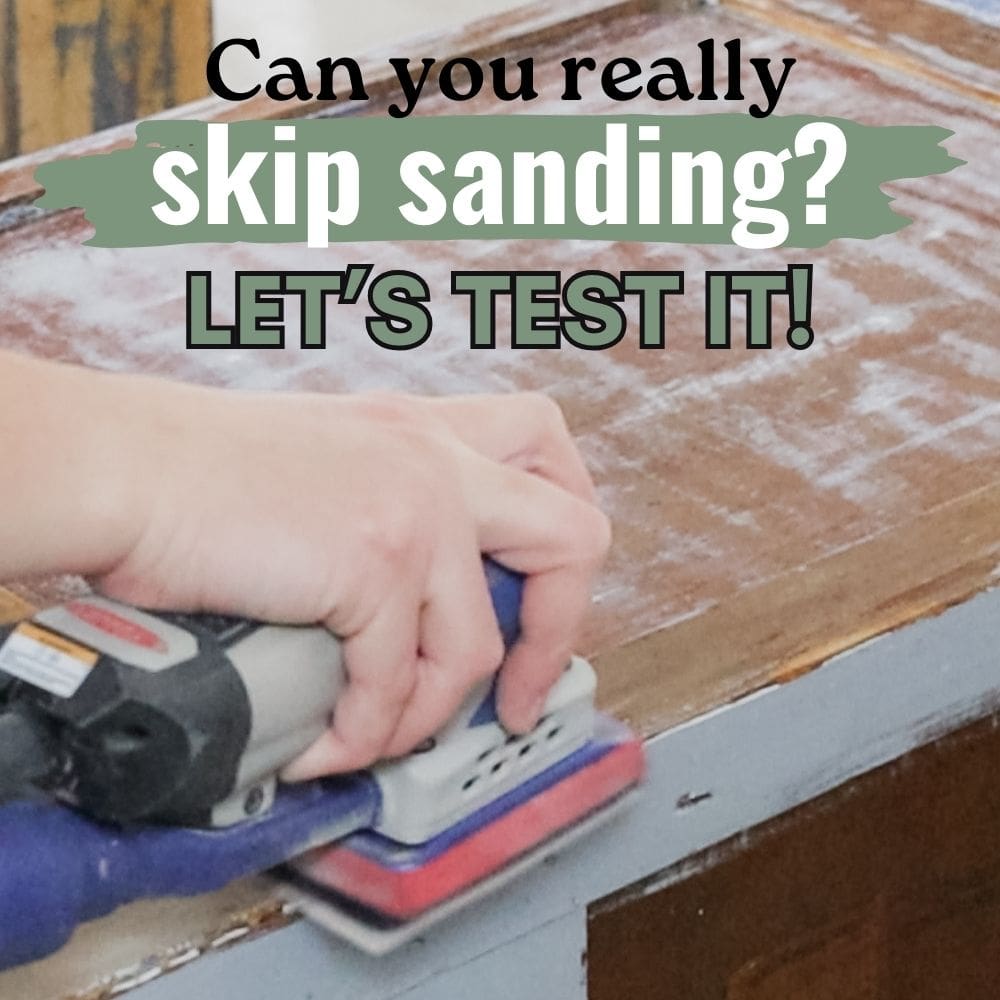 Closeup of hand using an electric sander on wood