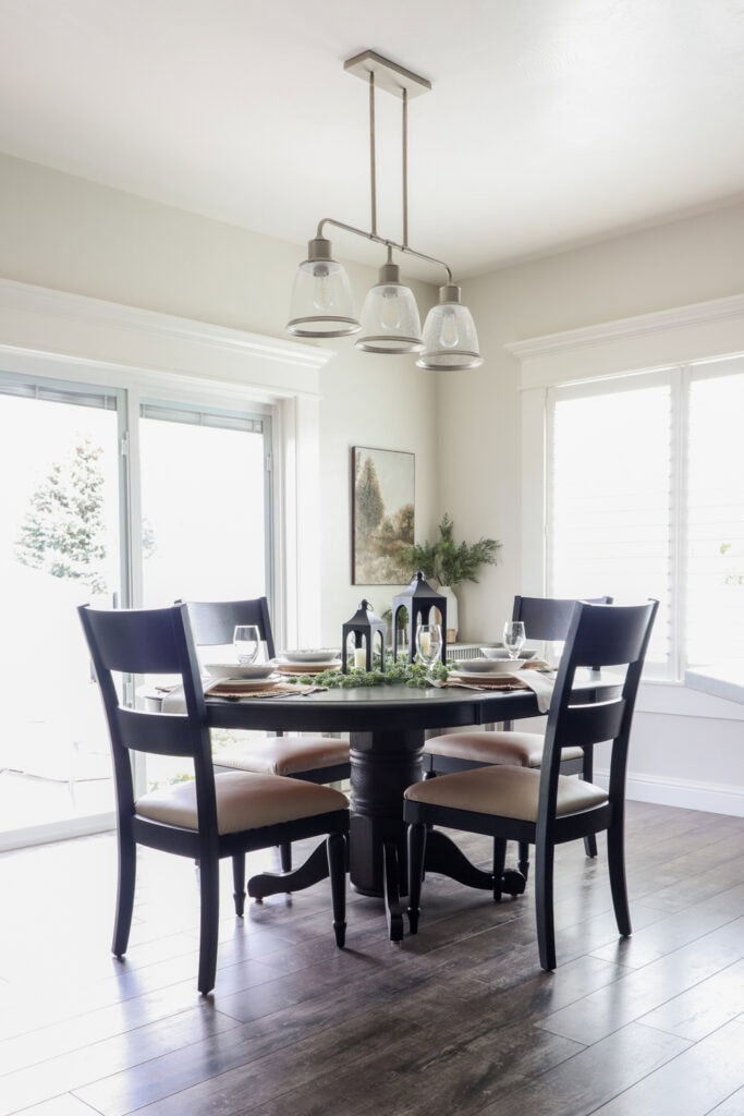 A round dining table with four chairs after makeover