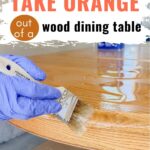 A gloved hand brushes chemical stripper on a wooden table